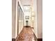Hallway with mosaic floors, linen closet, and view of the kitchen at 430 N Park Ave # 302, Indianapolis, IN 46202