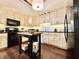 Well-equipped kitchen with black appliances, island, and lots of storage at 430 N Park Ave # 302, Indianapolis, IN 46202