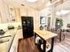 Well-lit kitchen features lots of cabinetry, black appliances, and central island at 430 N Park Ave # 302, Indianapolis, IN 46202