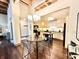 Open concept kitchen and dining area with stainless steel appliances and island at 430 N Park Ave # 302, Indianapolis, IN 46202