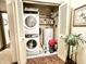 Convenient laundry room with in-unit washer and dryer and storage shelves at 430 N Park Ave # 302, Indianapolis, IN 46202