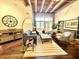 A bright living room with exposed ceiling beams and stylish decor at 430 N Park Ave # 302, Indianapolis, IN 46202