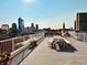 Enjoy the rooftop deck with skyline views and picnic seating at 430 N Park Ave # 302, Indianapolis, IN 46202