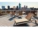 Enjoy the rooftop deck with skyline views and lounge seating at 430 N Park Ave # 302, Indianapolis, IN 46202