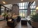 Sunlit common area with glass roof, brick walls and seating at 430 N Park Ave # 302, Indianapolis, IN 46202