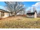 This fenced backyard features a grass yard, a shed, and mature trees at 5021 Tudor Cir, Carmel, IN 46033