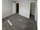 Comfortable bedroom with soft carpeting, neutral decor, and access to closet and hallway at 5142 Tuscany Ln, Indianapolis, IN 46254