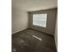 Cozy bedroom featuring plush carpeting, neutral walls, and a bright window at 5142 Tuscany Ln, Indianapolis, IN 46254
