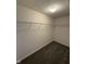Walk-in closet with carpeting and white wire shelving for organized storage at 5142 Tuscany Ln, Indianapolis, IN 46254