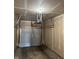 Unfinished garage with drywall, concrete floor, and a closed white garage door at 5142 Tuscany Ln, Indianapolis, IN 46254