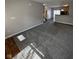 Spacious living room with gray walls and plush carpeting, perfect for relaxing or entertaining at 5142 Tuscany Ln, Indianapolis, IN 46254