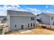 A charming backyard with a view of the house, featuring a small patio and fencing at 526 Carroll St, New Whiteland, IN 46184
