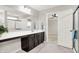 Bathroom boasts an extra long vanity with dark cabinets and a walk-in shower at 526 Carroll St, New Whiteland, IN 46184