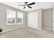 Bedroom with windows, closet, carpeted floors, a ceiling fan and neutral-toned walls at 526 Carroll St, New Whiteland, IN 46184