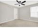 Bedroom featuring neutral carpet, a window, and a ceiling fan at 526 Carroll St, New Whiteland, IN 46184