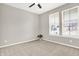 Bedroom with neutral carpet, two windows with blinds, ceiling fan, and gray walls at 526 Carroll St, New Whiteland, IN 46184