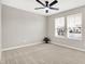 Bedroom with neutral walls, carpeted floors, ceiling fan, and a double window with exterior views at 526 Carroll St, New Whiteland, IN 46184