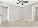 Bedroom with neutral carpet, a ceiling fan and multiple entryways at 526 Carroll St, New Whiteland, IN 46184