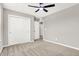 Bedroom showcasing neutral walls, carpeted floors, ceiling fan and a double door closet at 526 Carroll St, New Whiteland, IN 46184