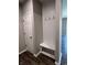 Charming entryway with a built-in hall tree featuring coat hooks and a convenient bench for seating at 526 Carroll St, New Whiteland, IN 46184