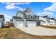 Inviting two-story home with a two-car garage, extended driveway, and well-maintained lawn at 526 Carroll St, New Whiteland, IN 46184