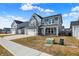 Attractive two-story home with a two-car garage, neat lawn, and inviting covered porch at 526 Carroll St, New Whiteland, IN 46184