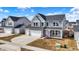 Charming two-story home featuring a two-car garage and a welcoming front porch at 526 Carroll St, New Whiteland, IN 46184