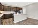 Modern kitchen with stainless steel appliances, an island with seating, and ample counter space at 526 Carroll St, New Whiteland, IN 46184