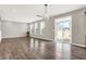 Bright, open living space with wood-look flooring, recessed lighting, and sliding glass door at 526 Carroll St, New Whiteland, IN 46184