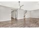 Open living area with hardwood floors, modern lighting, and stairway access to the upper level at 526 Carroll St, New Whiteland, IN 46184