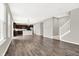 Stylish living area with wood-look flooring leading to the modern kitchen and staircase at 526 Carroll St, New Whiteland, IN 46184