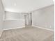 Open loft area with neutral carpet and view of the hallway and other rooms at 526 Carroll St, New Whiteland, IN 46184