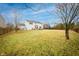 Expansive backyard with a large lawn, a wooden fence, and a home with a deck at 538 Cyclamen Chase, Westfield, IN 46074