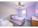 Calm bedroom with purple accents, a ceiling fan, and comfortable decor at 538 Cyclamen Chase, Westfield, IN 46074
