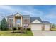 Charming brick two-story home with a three-car garage and well-maintained landscaping at 538 Cyclamen Chase, Westfield, IN 46074