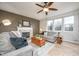 Comfortable living room with a fireplace, two couches, hardwood floors, and lots of light at 538 Cyclamen Chase, Westfield, IN 46074