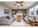 Inviting living room with fireplace, hardwood floors, two sofas, and lots of natural light at 538 Cyclamen Chase, Westfield, IN 46074