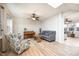 Spacious living room with lots of natural light, hardwood floors, light gray couch, and high ceilings at 538 Cyclamen Chase, Westfield, IN 46074