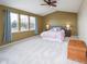 Spacious main bedroom with large windows, ceiling fan, and plush carpet, ideal for relaxation at 538 Cyclamen Chase, Westfield, IN 46074
