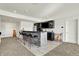 Finished basement bar featuring black cabinets, a flat-screen television, and a counter with barstool seating at 565 Old Ashbury Rd, Westfield, IN 46074