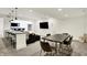Finished basement area with a dining table, sectional sofa, wet bar, and recessed lighting at 565 Old Ashbury Rd, Westfield, IN 46074