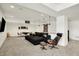 Open basement area featuring a large sectional, modern chair with ottoman, dining table, and recessed lighting at 565 Old Ashbury Rd, Westfield, IN 46074
