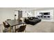 Large finished basement featuring a dining table, sectional sofa, and a bar area with pendant lighting at 565 Old Ashbury Rd, Westfield, IN 46074