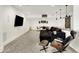 Basement area featuring a sectional, modern chair with ottoman, dining table, and a flat screen TV at 565 Old Ashbury Rd, Westfield, IN 46074