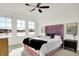 Cozy bedroom features a comfortable bed, natural light from windows, and stylish decor accents at 565 Old Ashbury Rd, Westfield, IN 46074