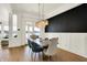 Elegant dining room with modern chandelier and a sleek accent wall at 565 Old Ashbury Rd, Westfield, IN 46074
