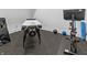 Home gym featuring a massage table, exercise bike, and fitness equipment, designed for a healthy lifestyle at 565 Old Ashbury Rd, Westfield, IN 46074