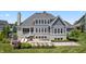 Stunning home with a patio, outdoor kitchen, fire pit, hot tub, and bocce ball court at 565 Old Ashbury Rd, Westfield, IN 46074
