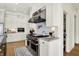 This state-of-the-art kitchen features stainless steel appliances and a professional grade range at 565 Old Ashbury Rd, Westfield, IN 46074
