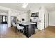 Gourmet kitchen with stainless steel appliances, ample counter space, and stylish island seating at 565 Old Ashbury Rd, Westfield, IN 46074